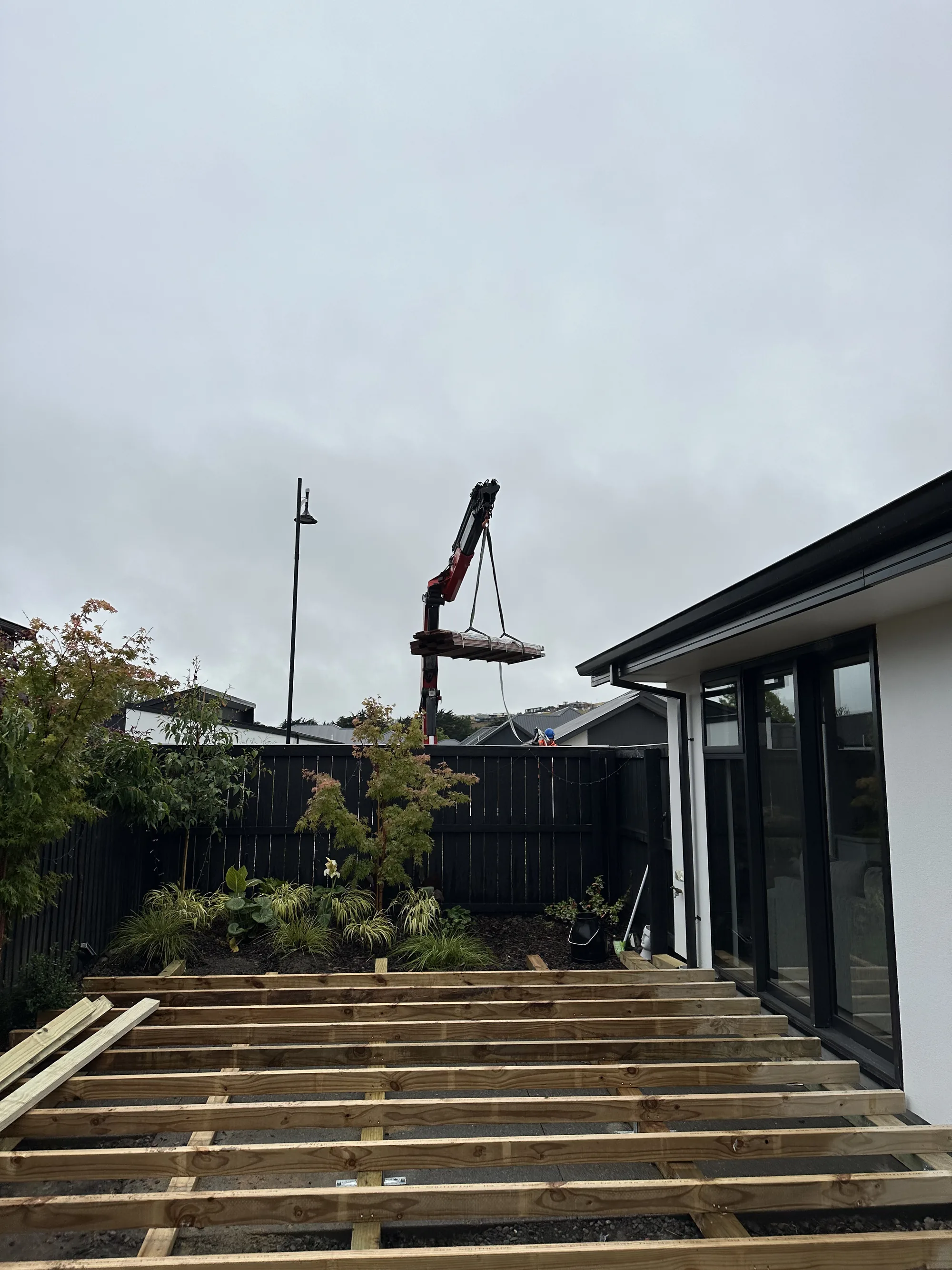 Timber retaining wall and integrated deck build
