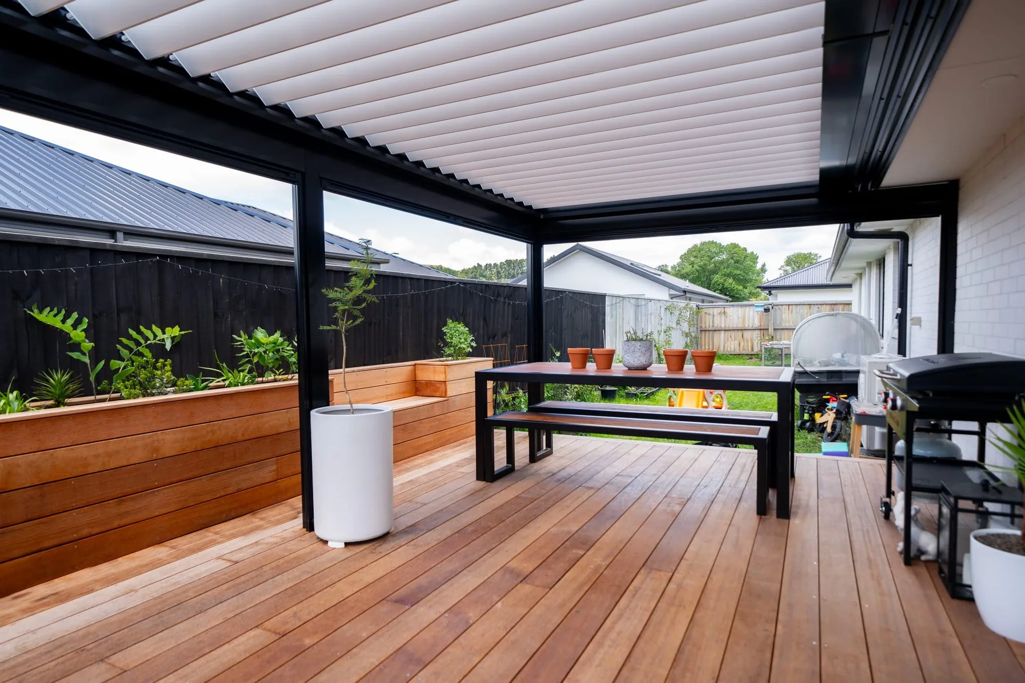 Louvre roof with outdoor dining setup