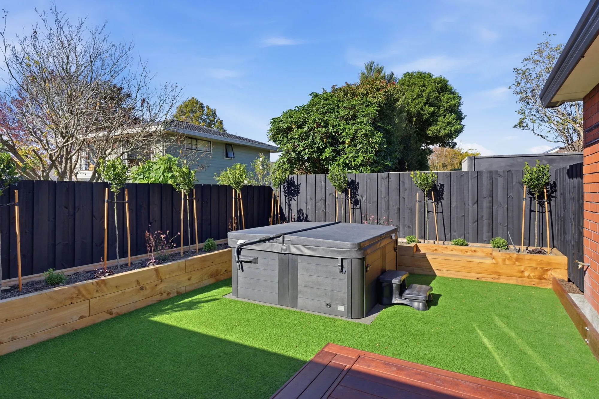 Low-level composite deck with hot tub surround